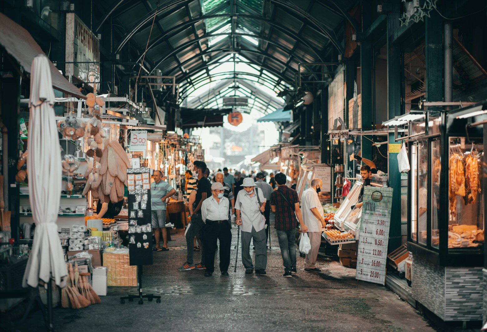 a group of people walking through a market